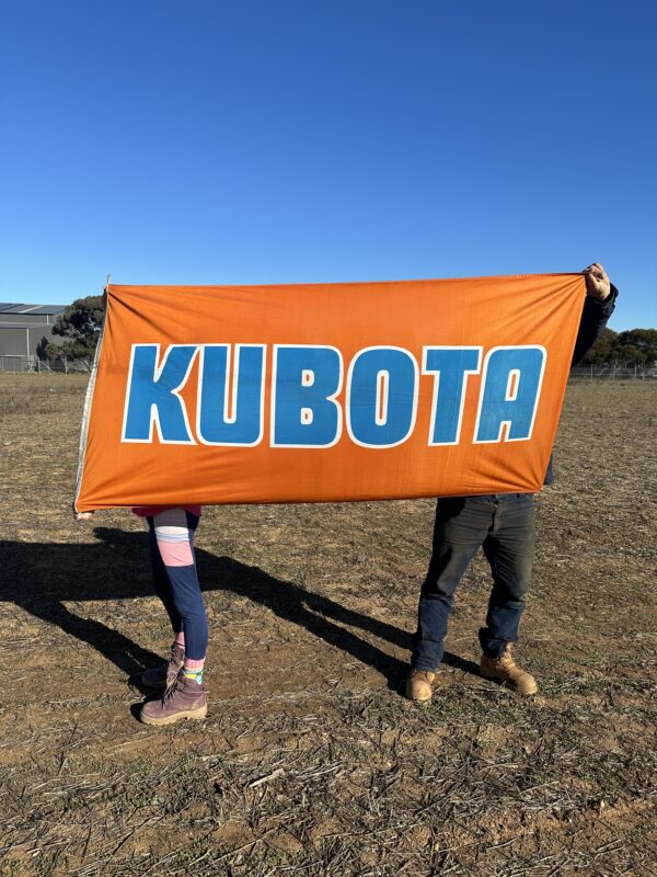 Vibrant coloured Kubota tractor flag.